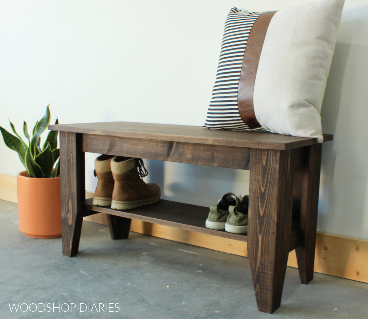Completed simple DIY bench project with shoe shelf stained dark brown