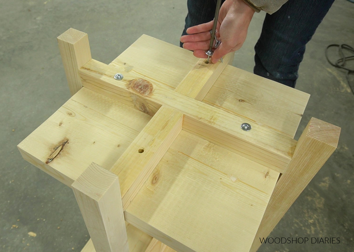 Shara Woodshop Diaries using screws and washers to secure bottom shelf of plant stand from underneath