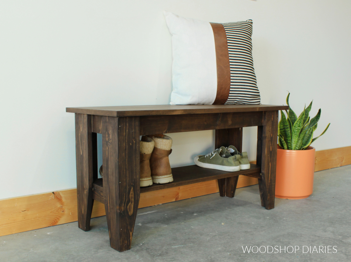 Completed simple wooden bench with shoe shelf stained dark brown