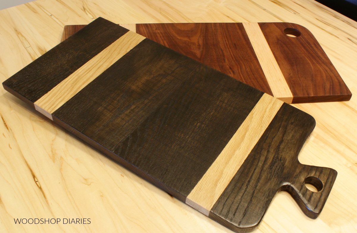 Two multicolor cutting boards laying on table top