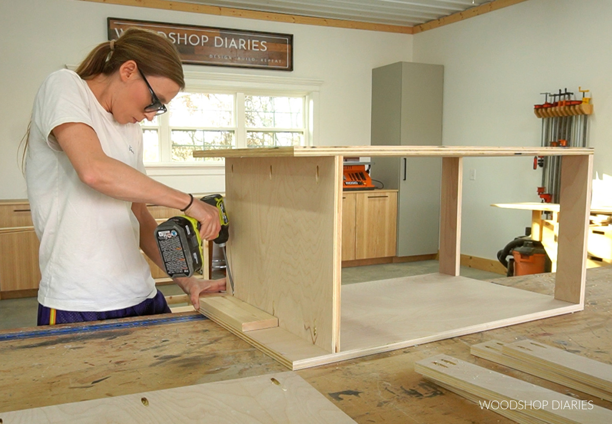 Shara Woodshop Diaries assembling plywood cabinet on workbench