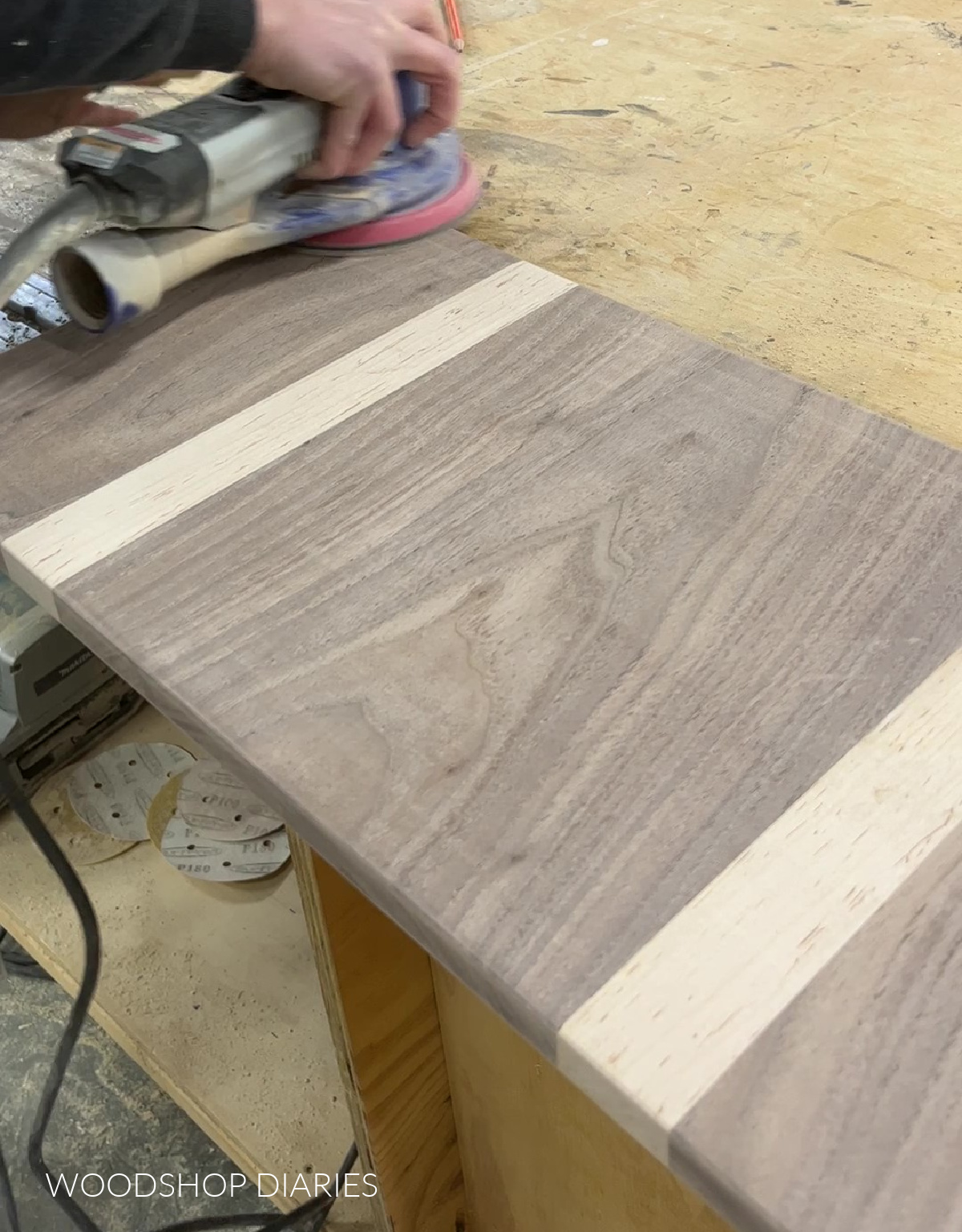 orbital sander sanding maple and walnut cutting board