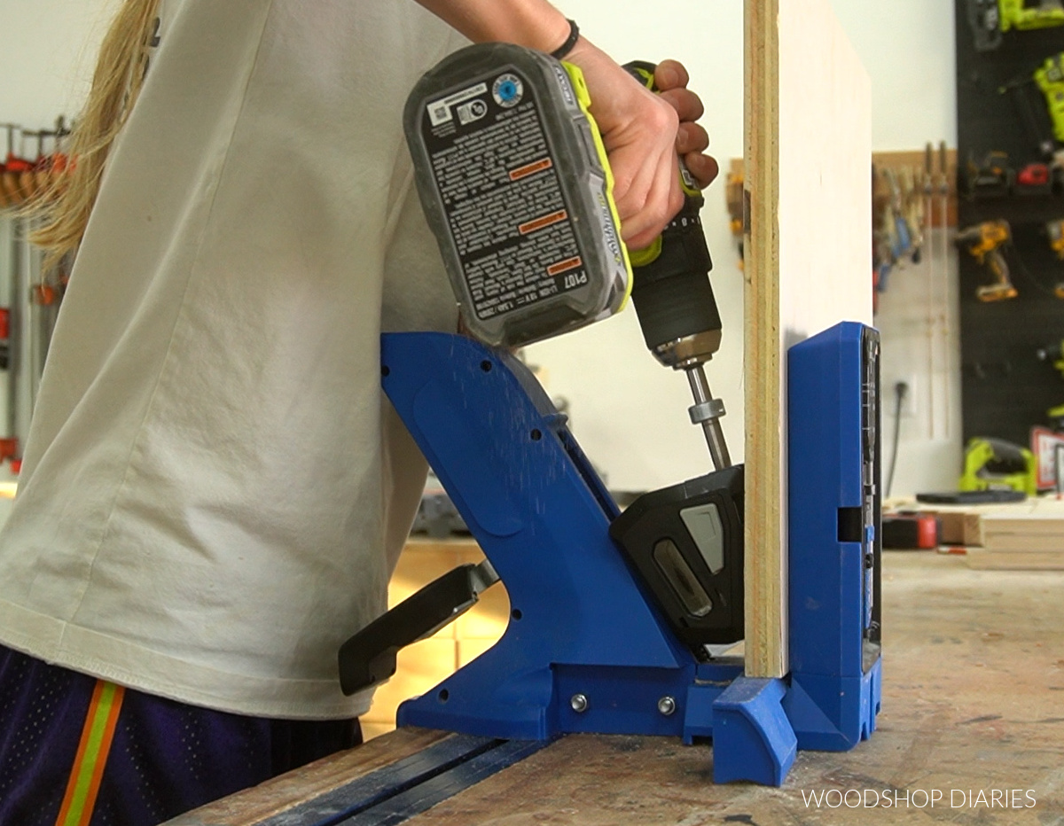 Shara Woodshop Diaries drilling pocket holes on Kreg 720 jig on workbench