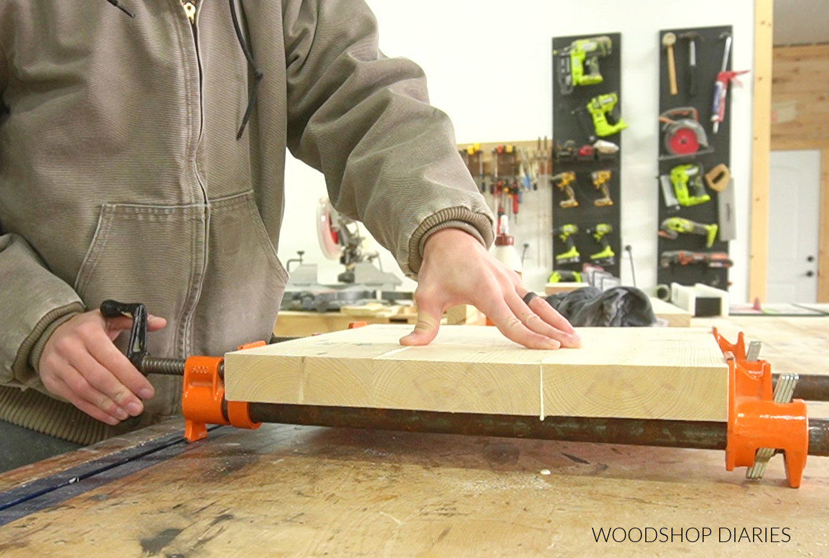 Shara Woodshop Diaries gluing up top and bottom shelf panels for plant stand build