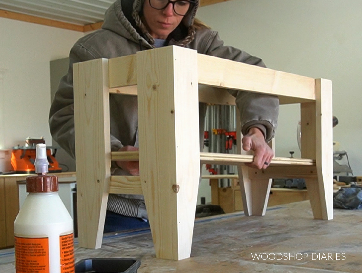 Shara Woodshop Diaries adding shelf panel into bench to test fit