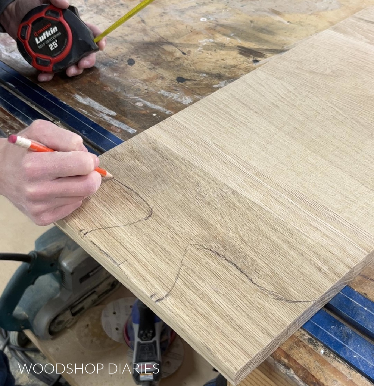 using a pencil to draw handle for DIY charcuterie board design