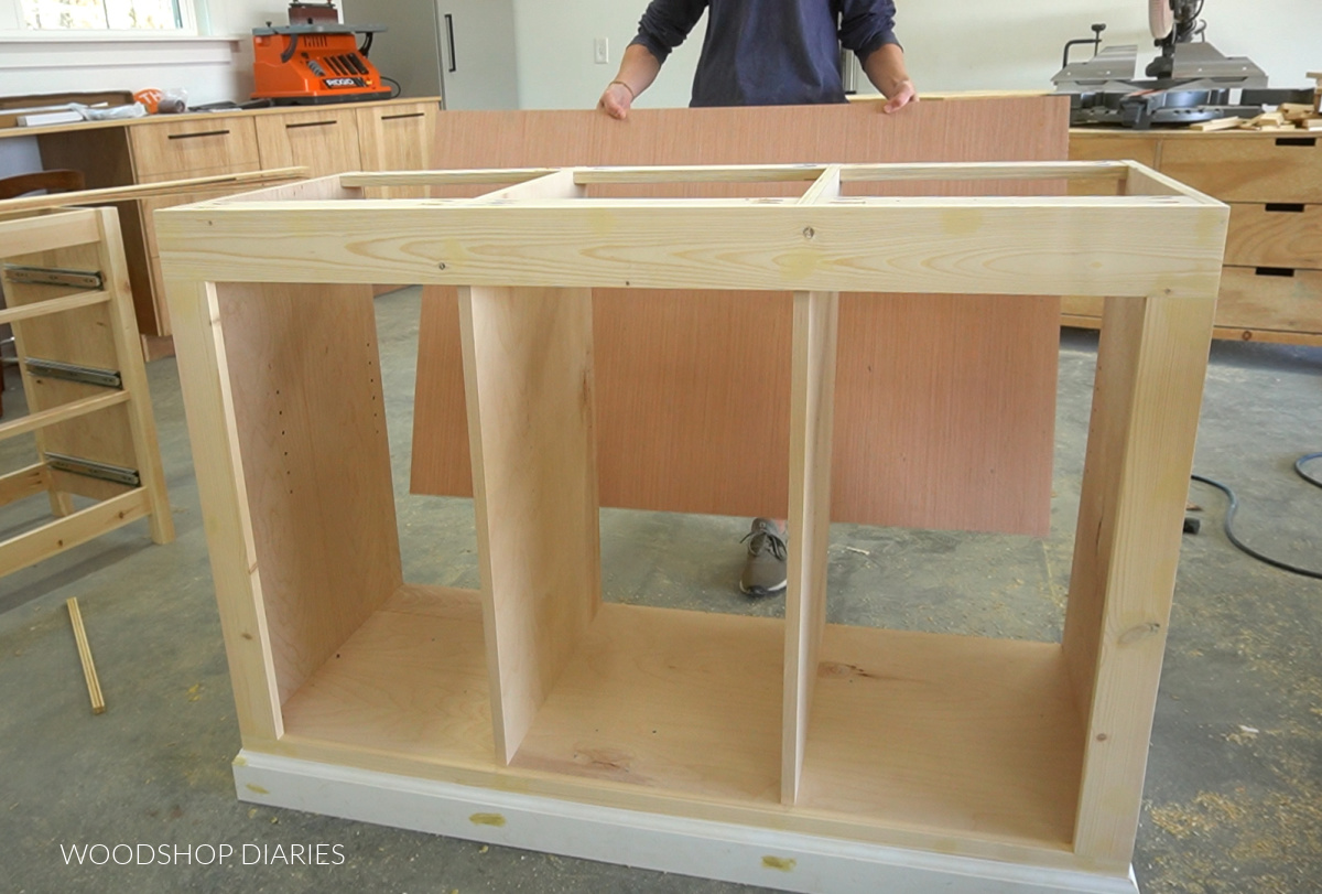 Shara Woodshop Diaries test fitting back panel onto sliding door cabinet