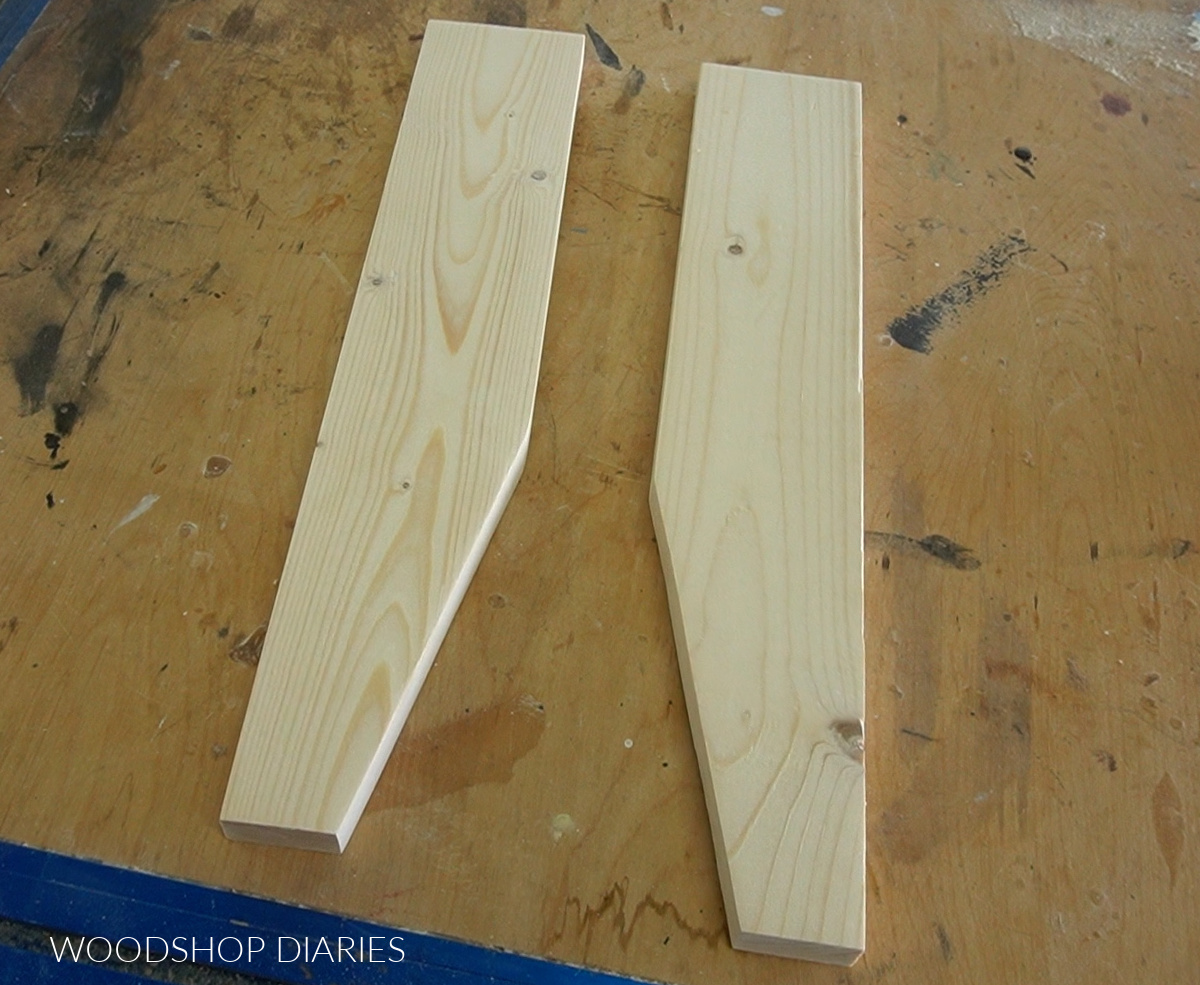 Bench leg pieces cut with slight taper laying out on workbench