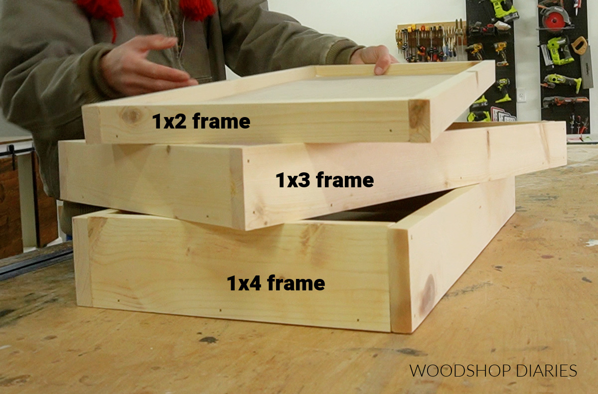 Three tiered shelves for rolling storage cart stacked on workbench 