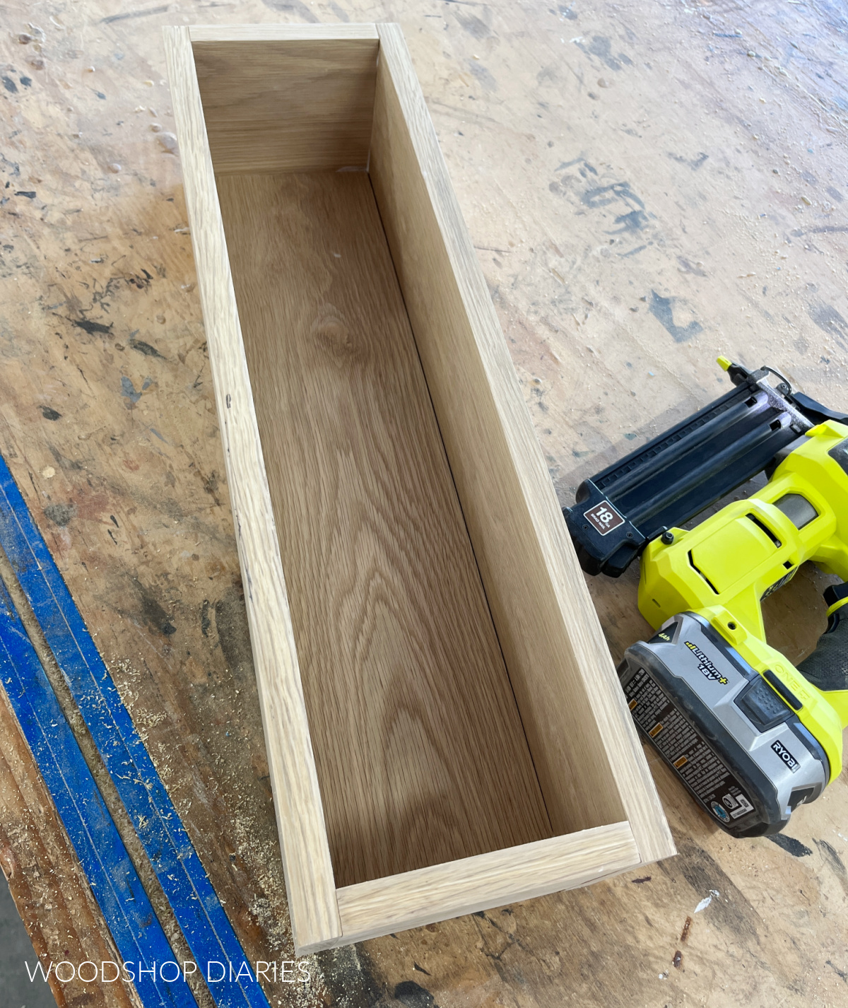 Wooden box fully assembled on workbench