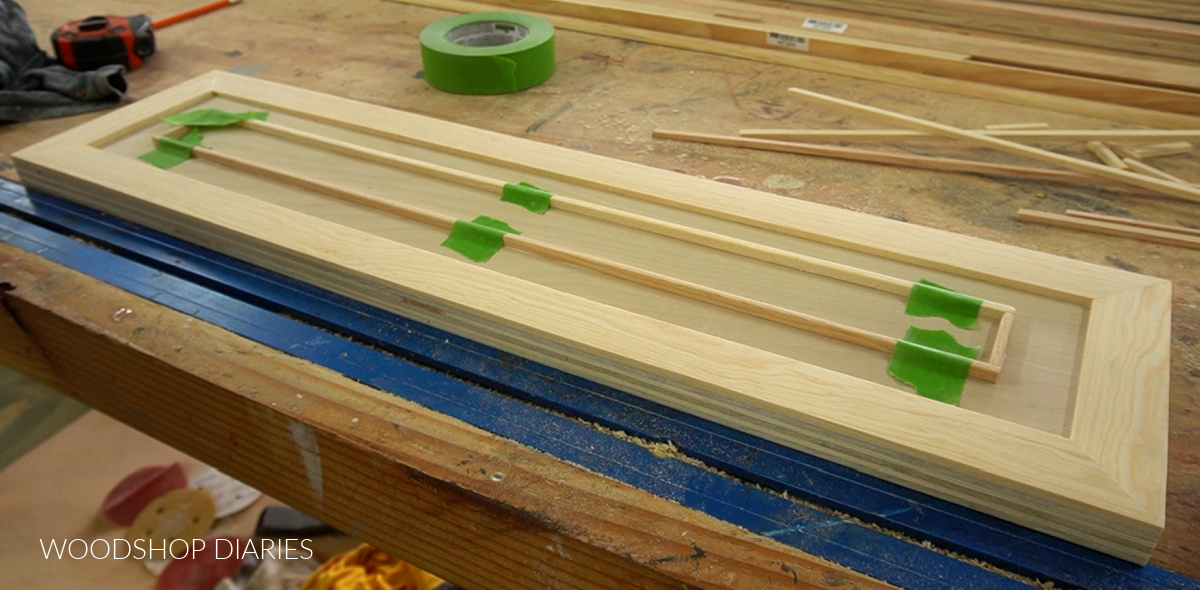 square dowel trim glued and taped onto drawer fronts