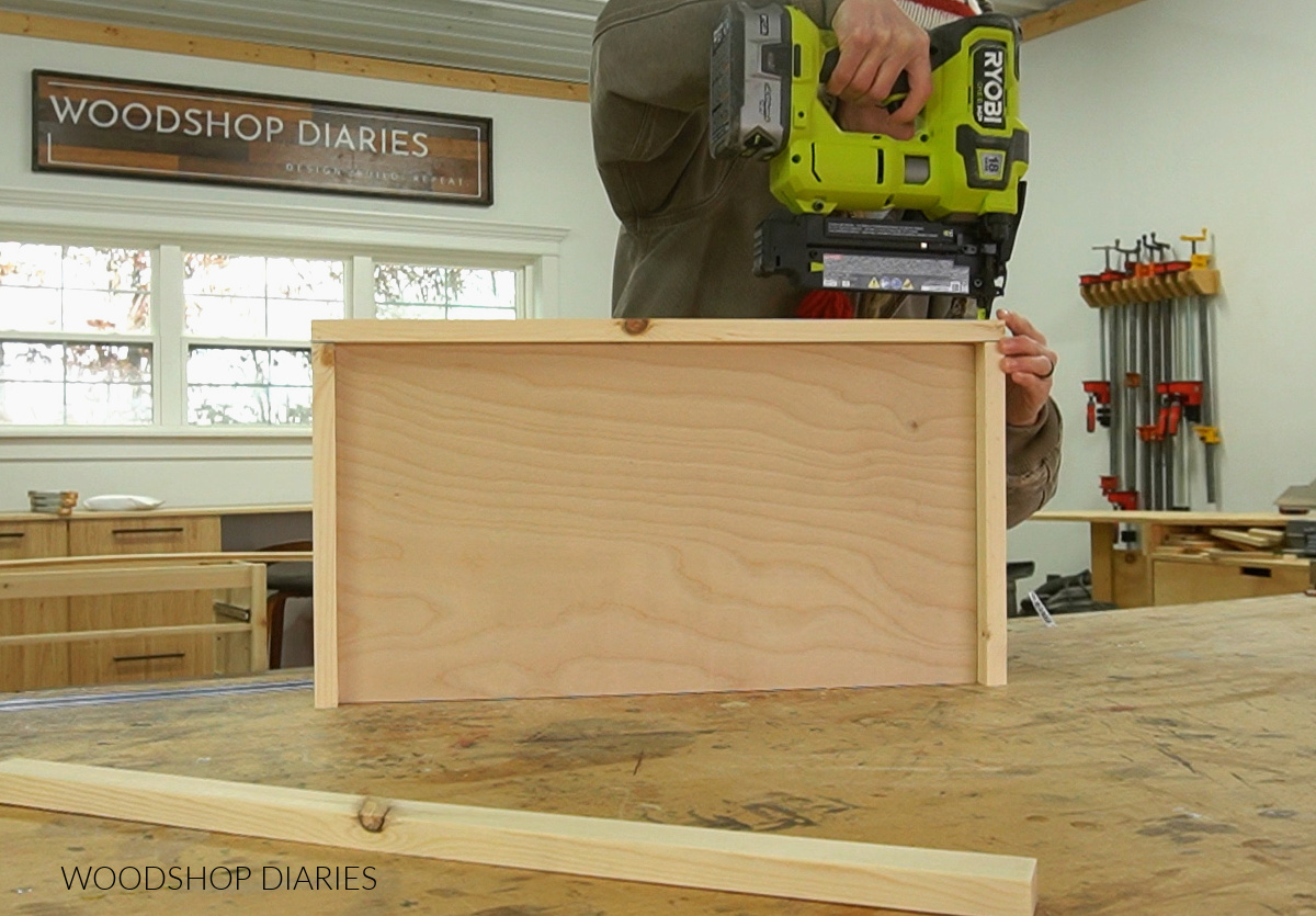 Shara Woodshop Diaries using nailer to attach frame around shelf panel