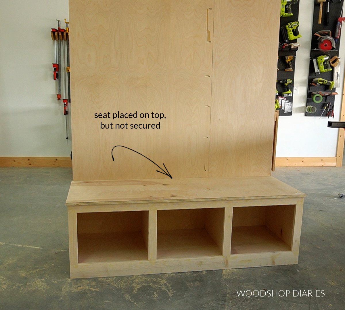 plywood hall tree build progress showing bench seat placed on top