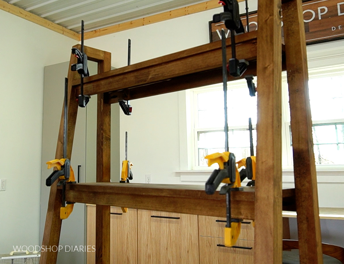 Shelves on bookshelf clamped in place