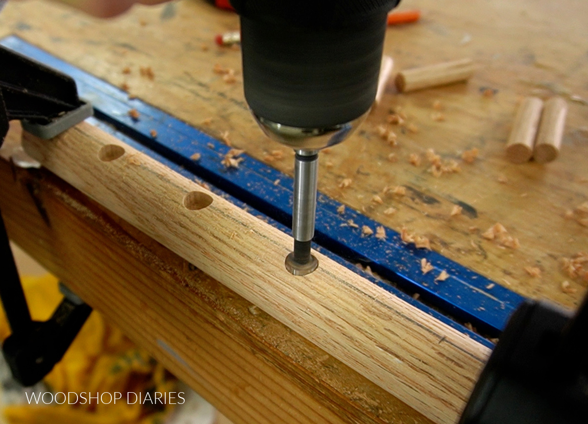 close up of forstner bit drilling holes for pegs