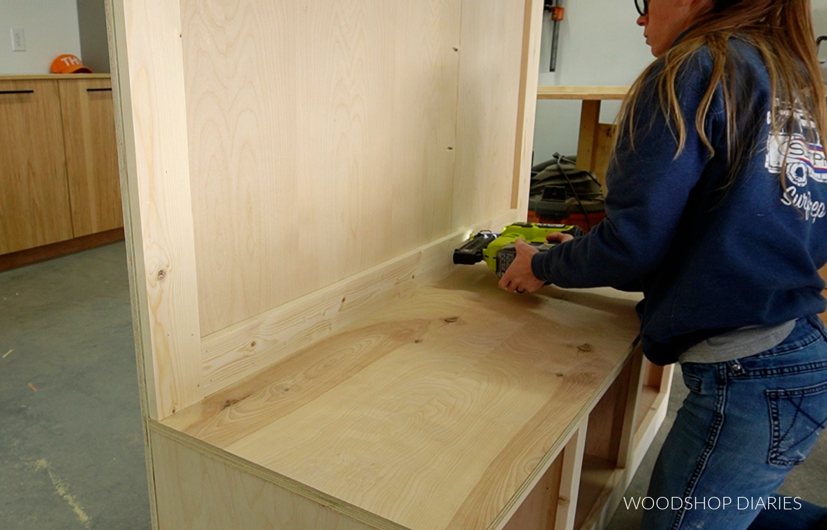 Shara Woodshop Diaries installing bottom piece of trim on back panel of hall tree