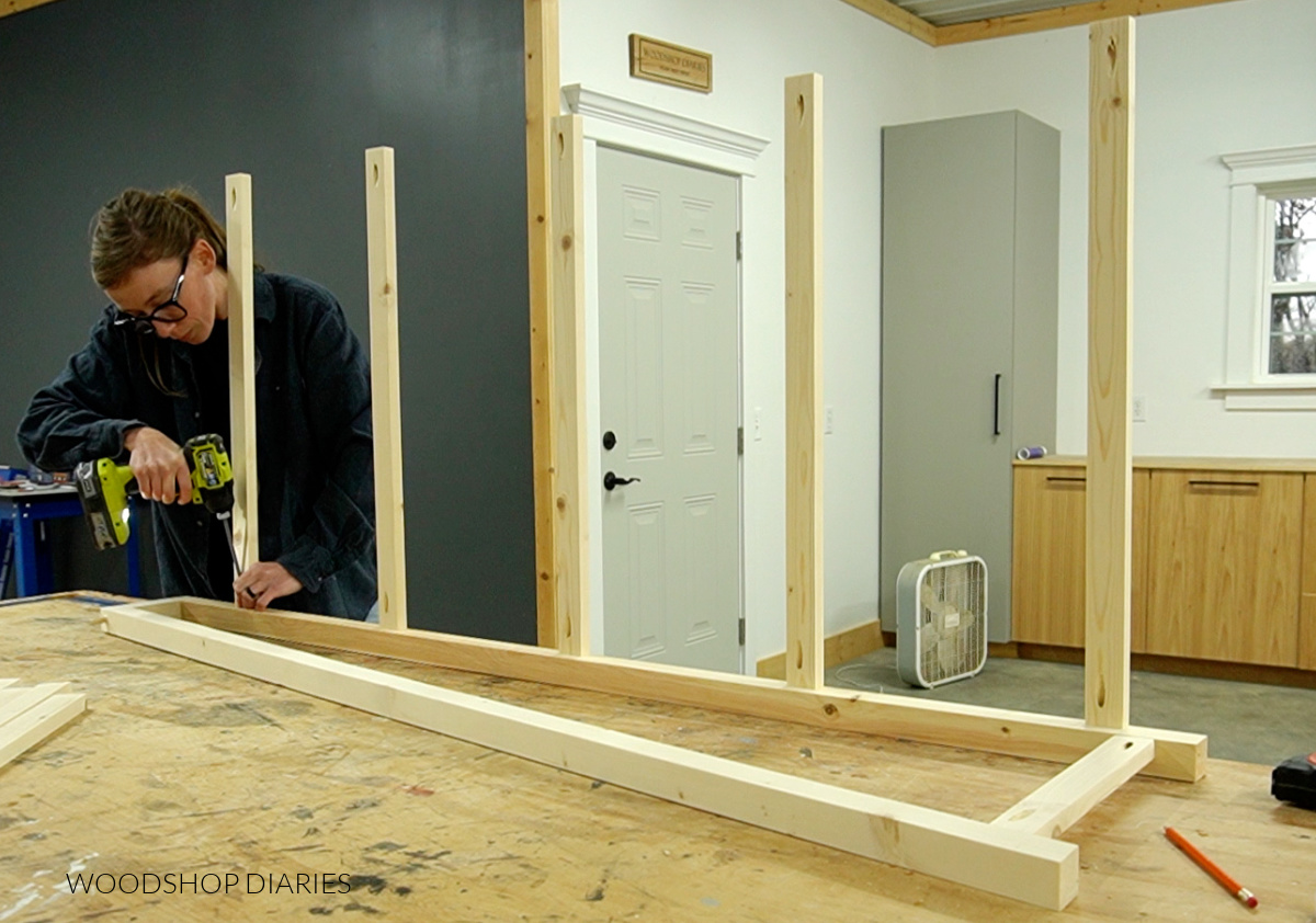 Shara Woodshop Diaries installing shelf support rungs onto bookshelf frame