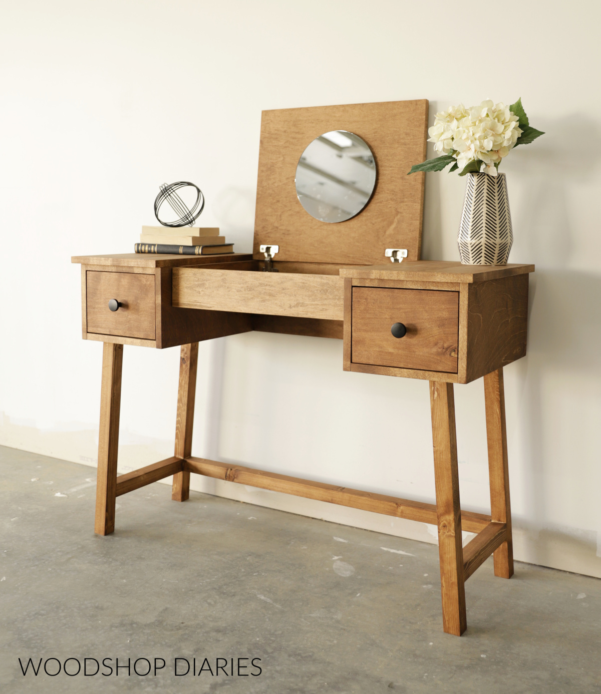 Wooden vanity desk with flip top open with mirror--two drawers on each side on a modern style base