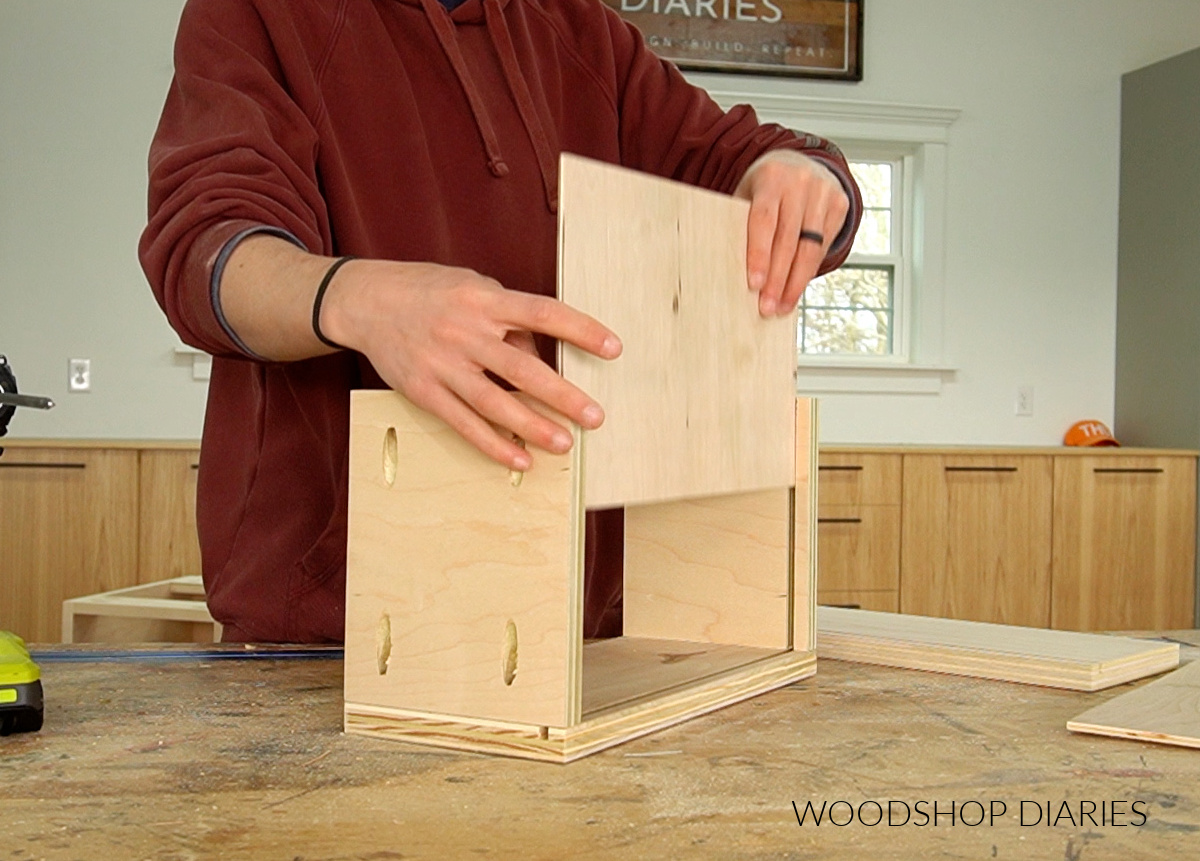 Shara Woodshop Diaries installing ¼" plywood bottom into drawer box dadoes on workbench