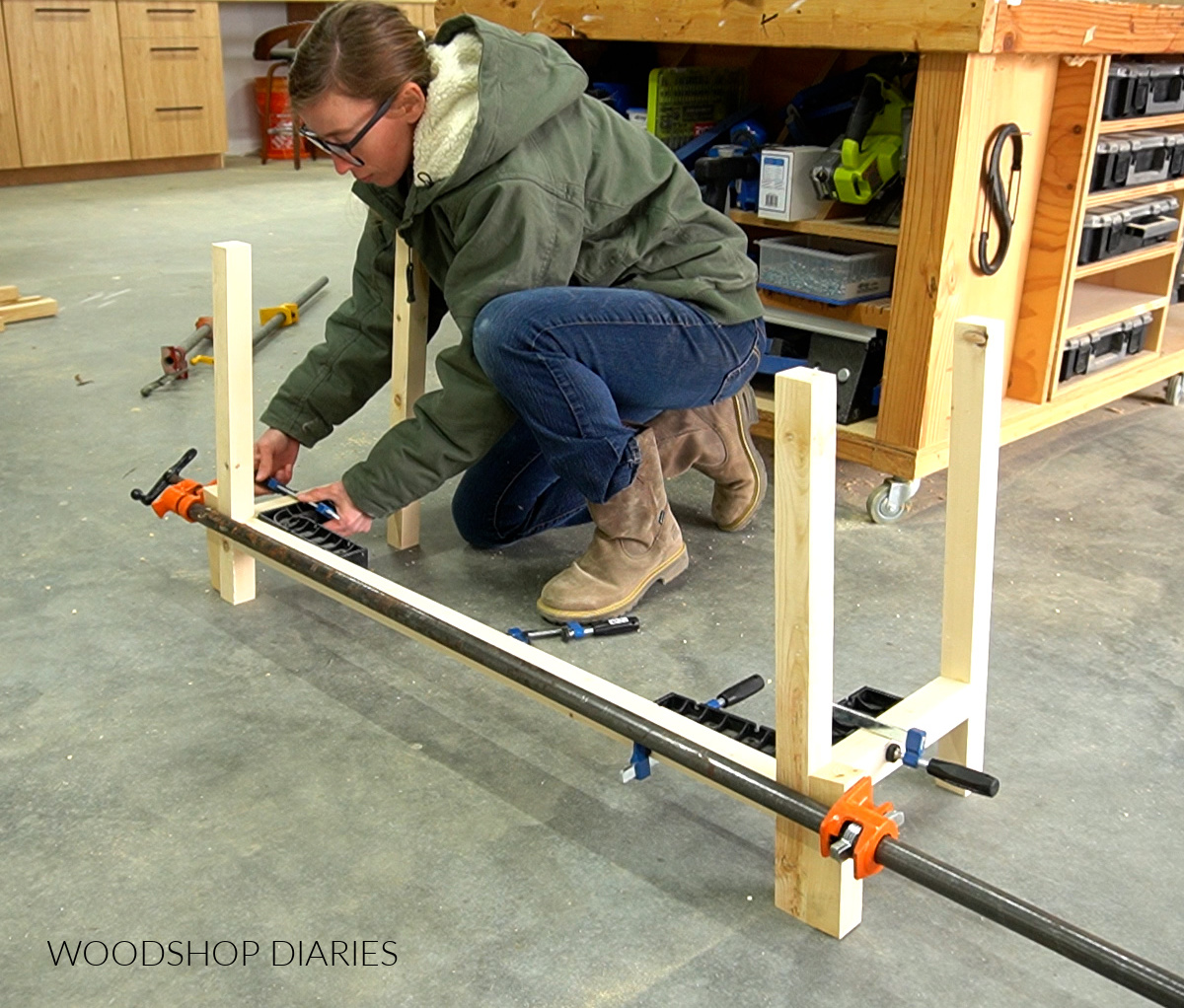 Shara Woodshop Diaries gluing up vanity desk base with corner clamps