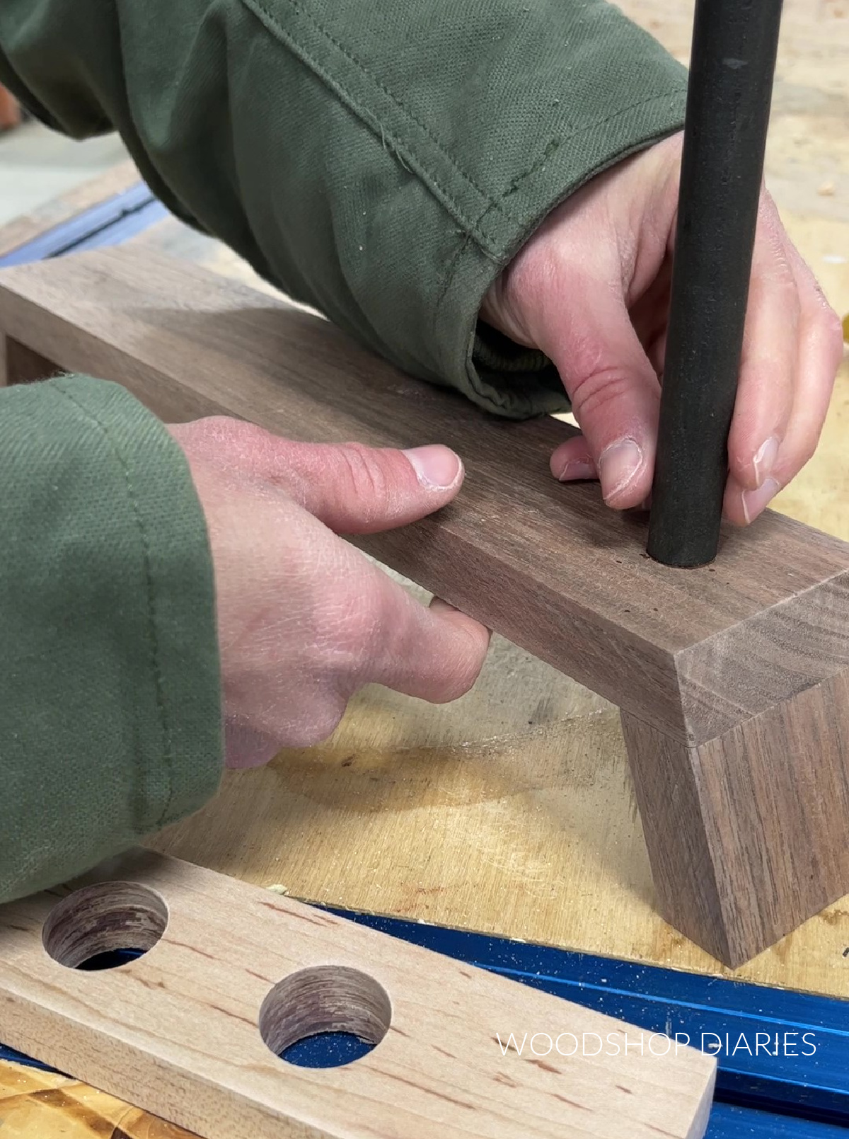 Close up of gluing dowel onto walnut propagation station base