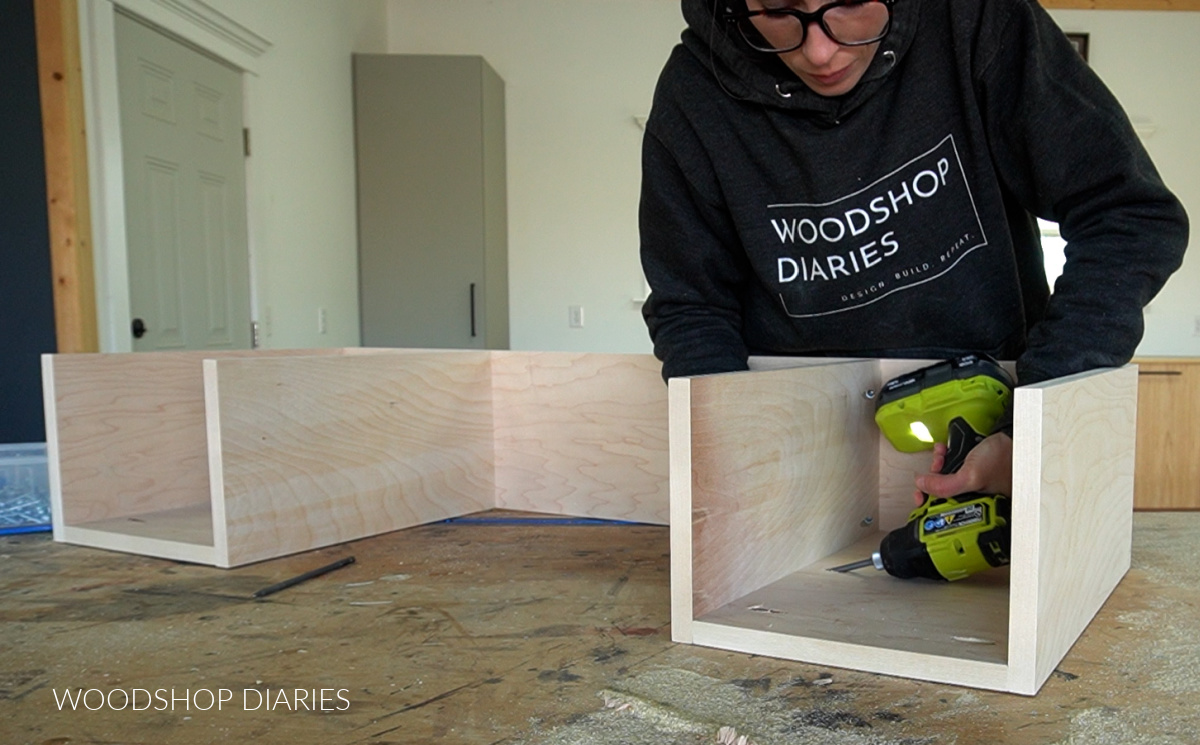 Shara Woodshop Diaries driving pocket holes in bottom panel of vanity desk build