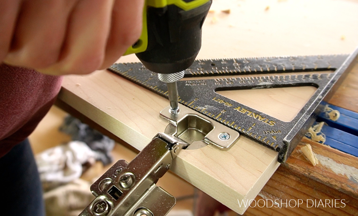 Close up driving screw to install concealed hinge onto cabinet door