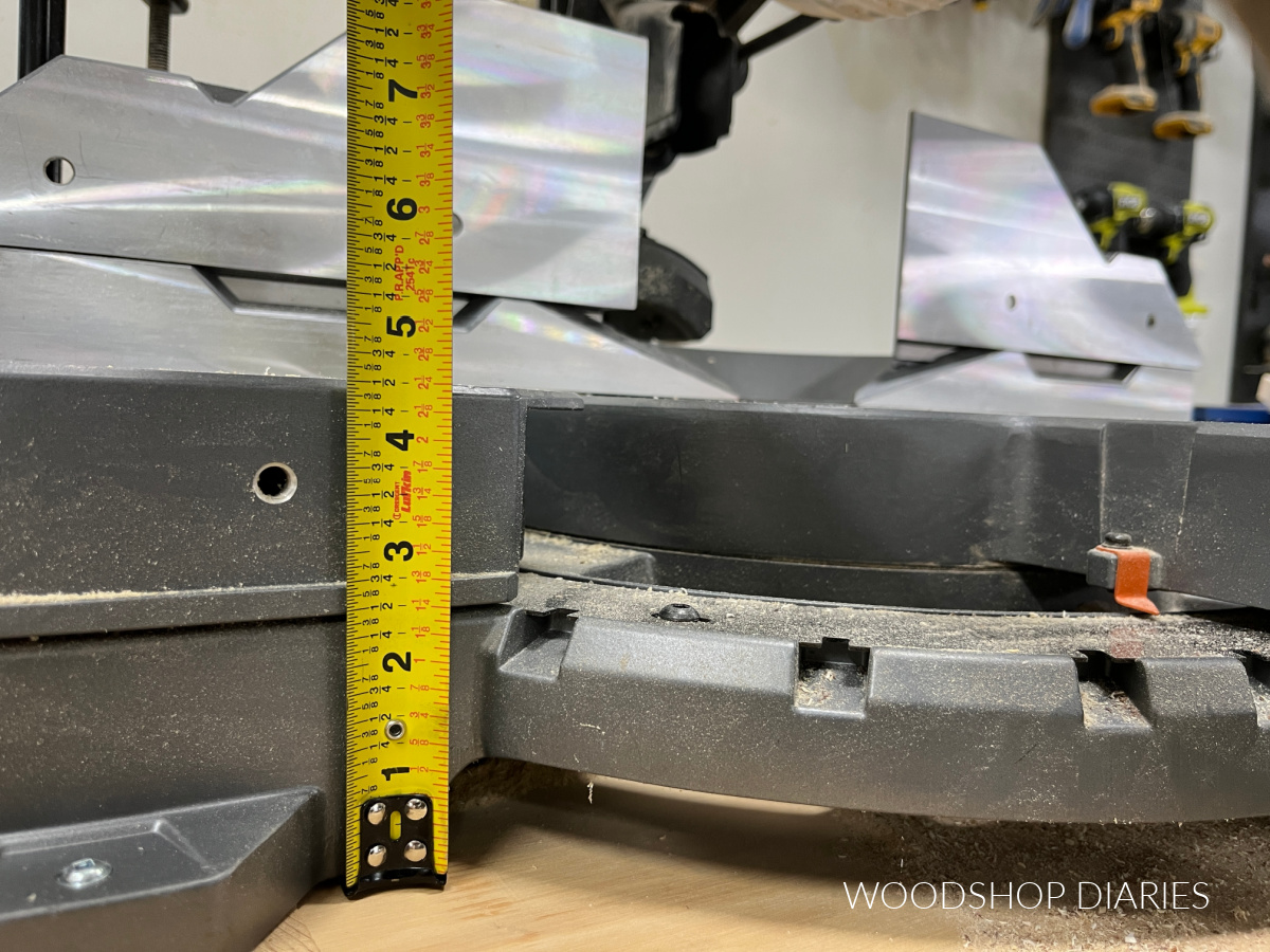 Close up of tape measure showing height of miter saw base