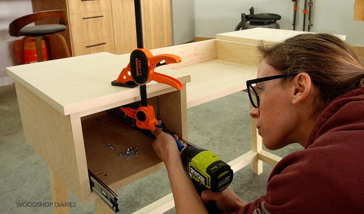 Shara Woodshop Diaries installing top side panels onto makeup vanity build