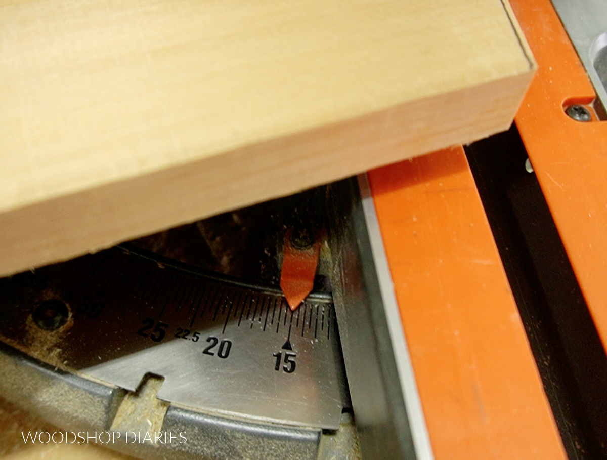 close up of miter saw angle showing 15 degrees