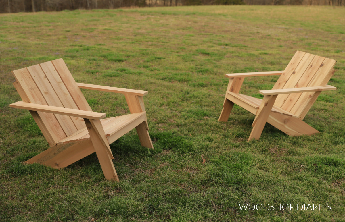 two matching modern DIY Adirondack chairs sitting in grass yard