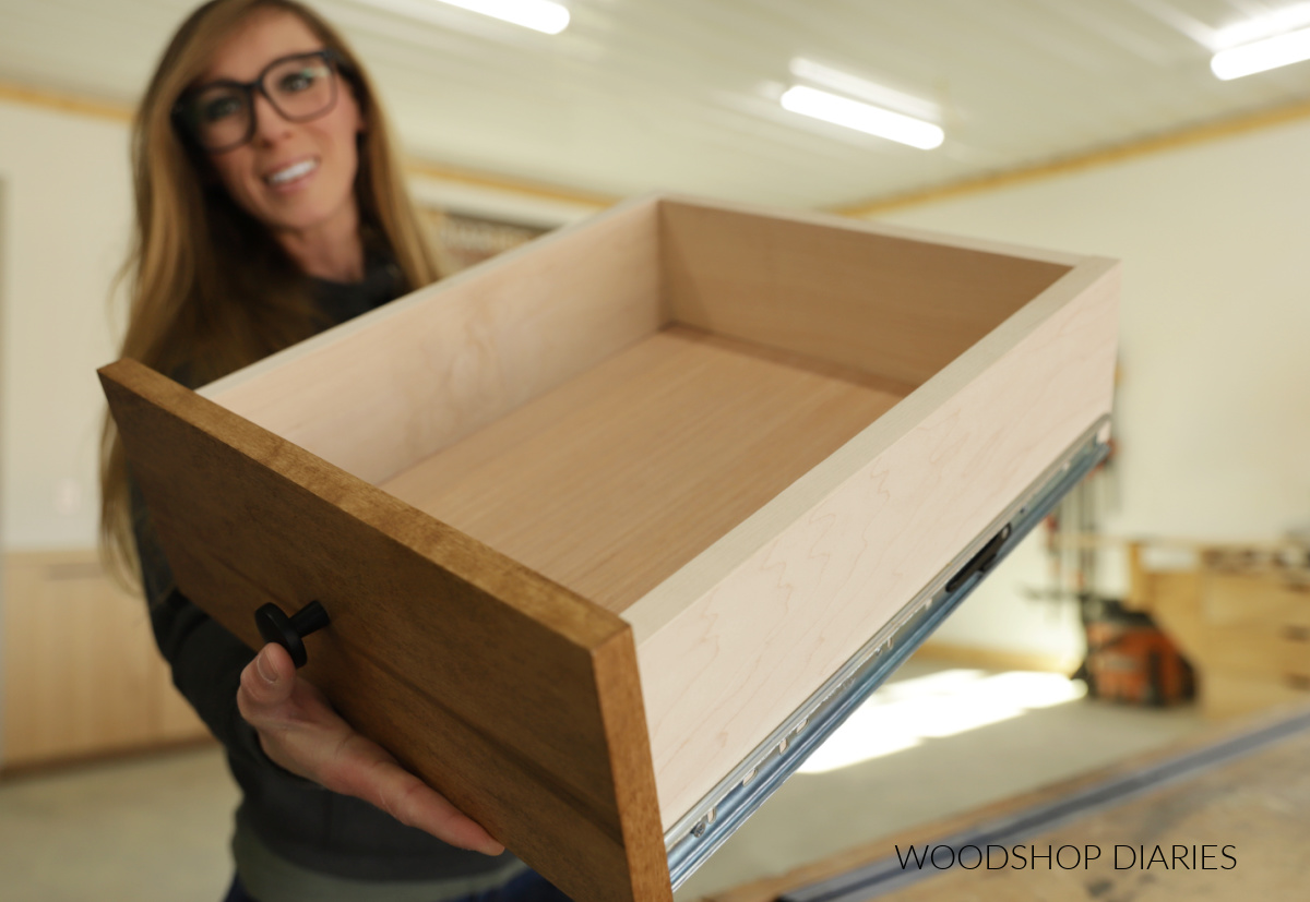 Shara Woodshop Diaries holding drawer box up close with blurred background