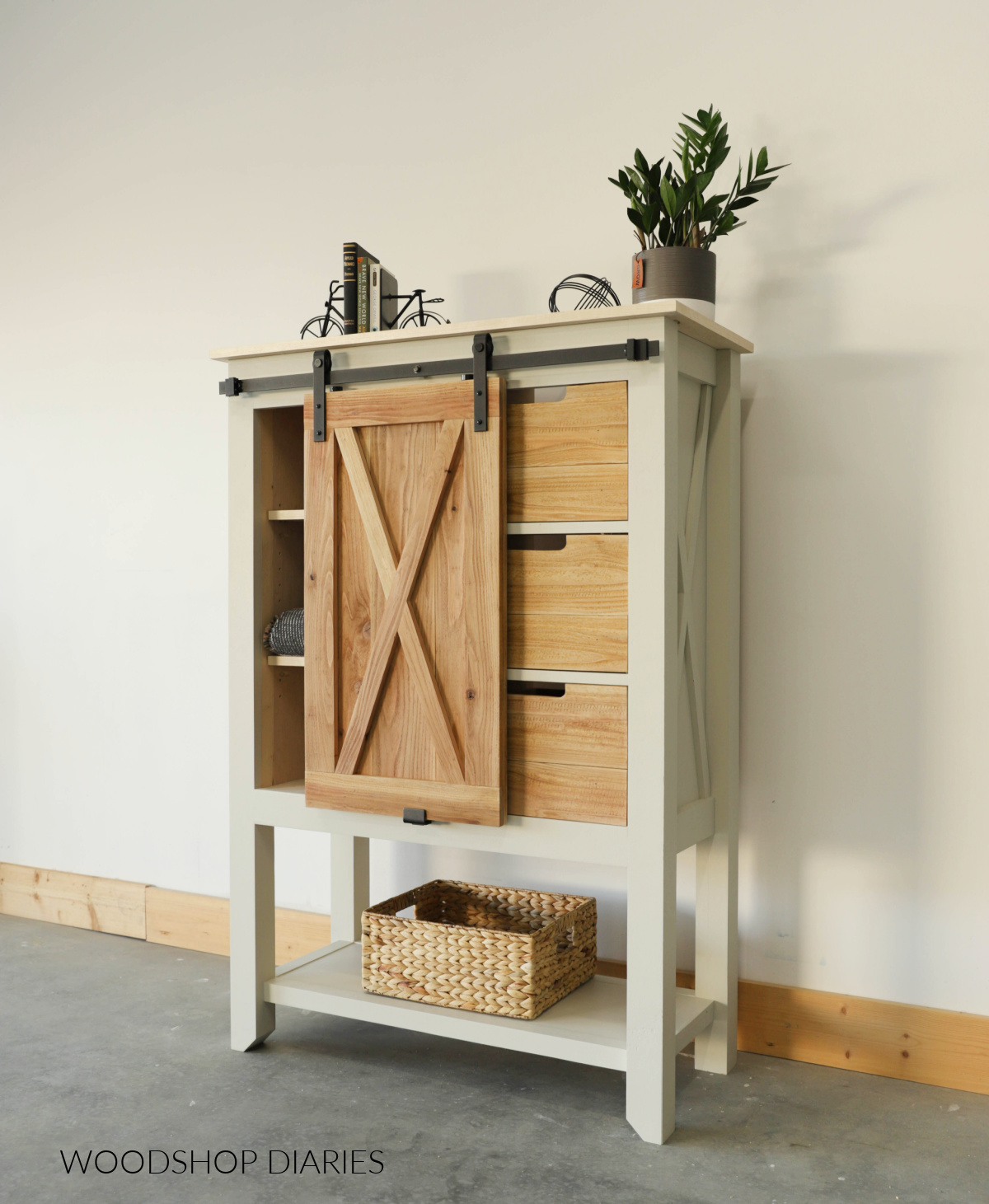 Painted farmhouse style chest of drawers with wood tone sliding door and drawer fronts