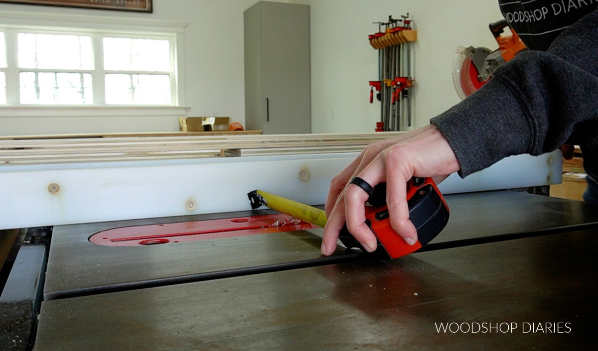 Close up of adjusting table saw rip fence