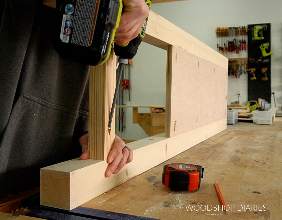 Shara Woodshop Diaries assembling side panels of DIY sliding door chest of drawers