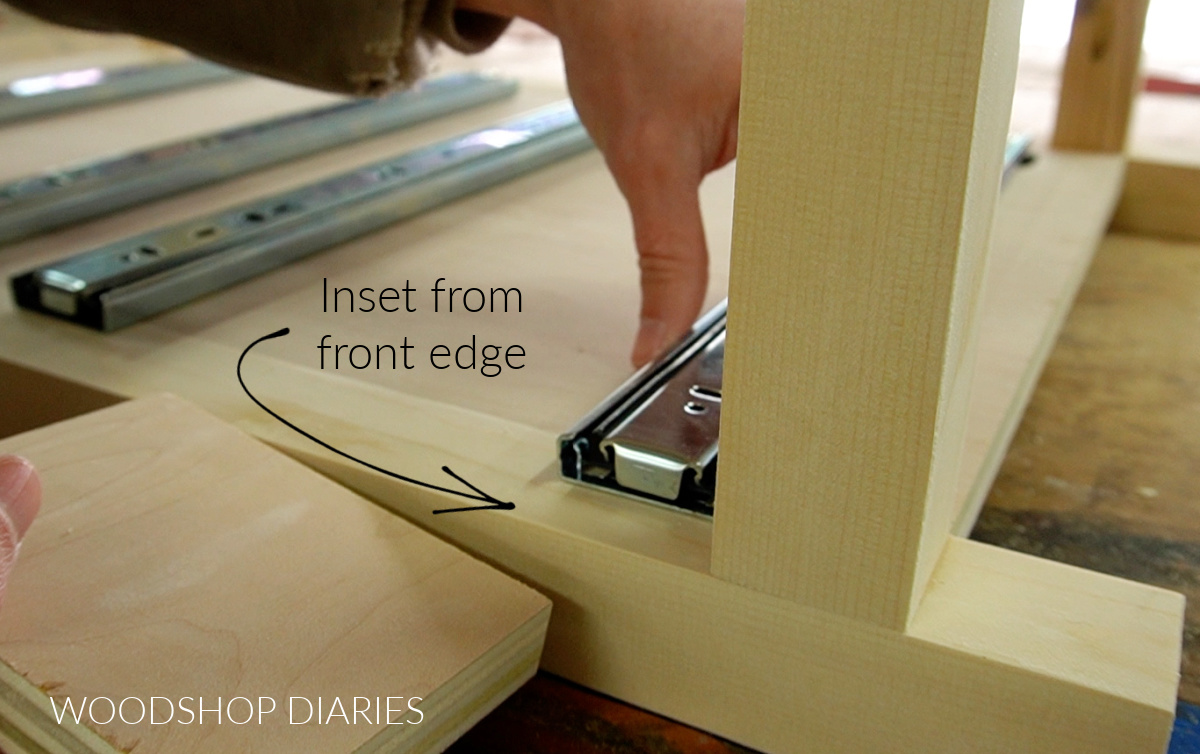 Close up of drawer slide inset from front edge of cabinet