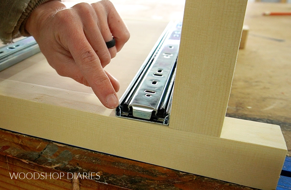 Close up of side mount slide flush to front edge of cabinet