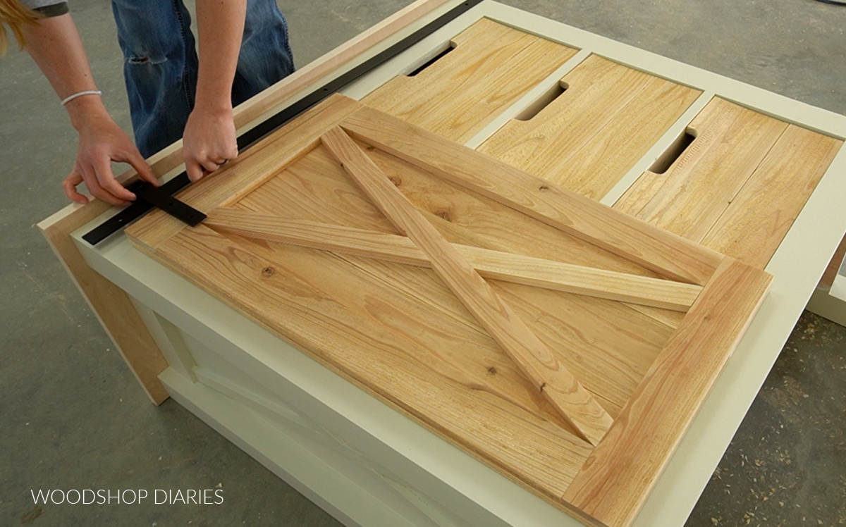 test fitting rollers onto sliding door hardware rail to make sure it doesn't hit top panel