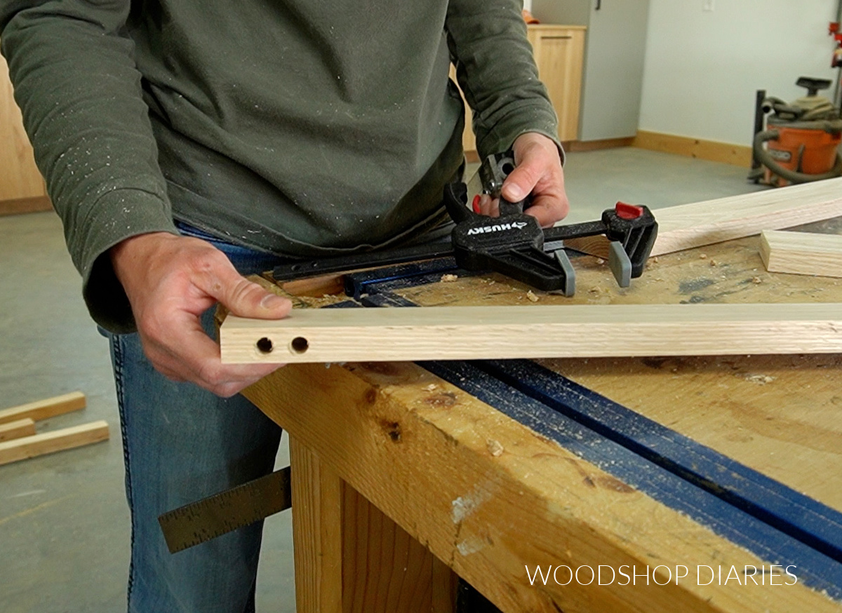 Dowel holes drilled in edge of board