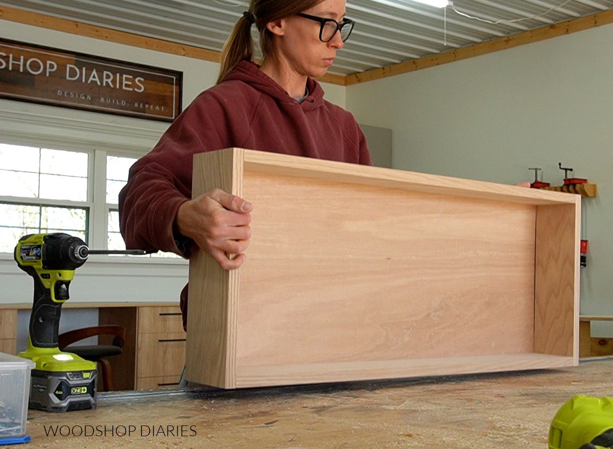 Shara Woodshop Diaries with assembled drawer box on workbench