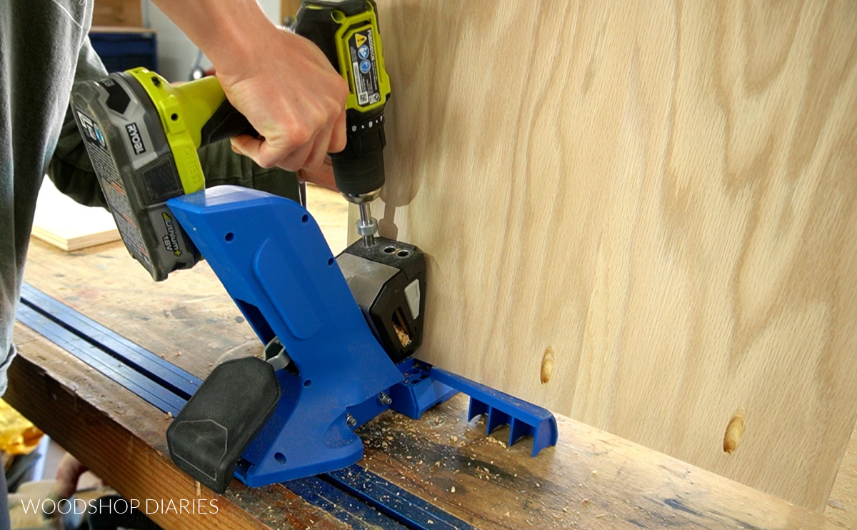 Close up of drilling pocket holes in plywood panel using Kreg 720 pocket hole jig