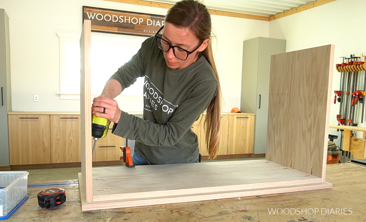 Shara Woodshop Diaries securing side panels to top panel on workbench using pocket hole screws