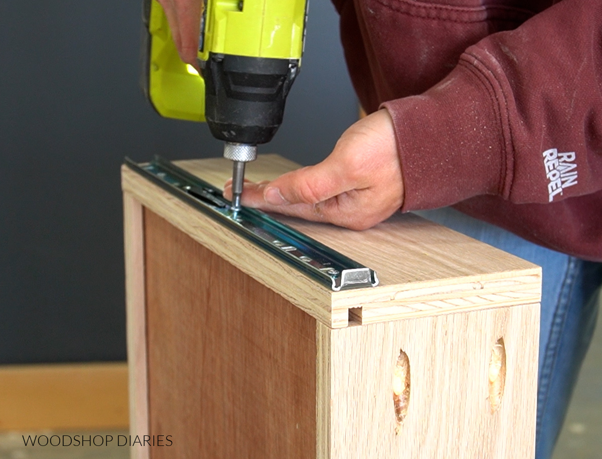 Close up of installing drawer slide into side of drawer box