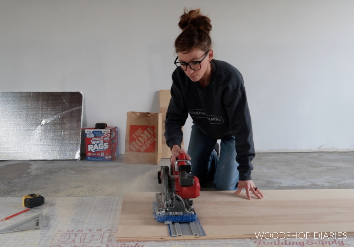 Shara Woodshop Diaries using circular saw and Kreg AccuCut to cut plywood panel on shop floor