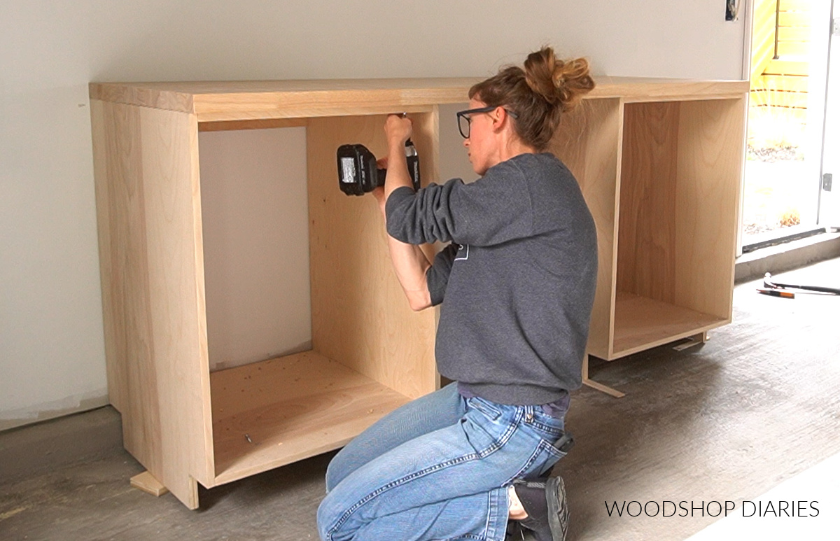 Shara Woodshop Diaries installing butcherblock countertop on workshop cabinets