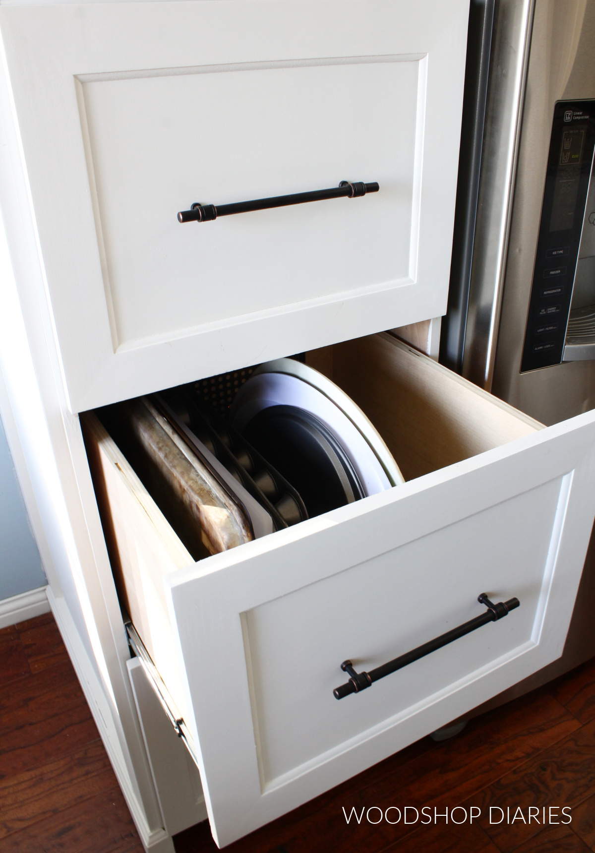 White shaker style drawer front with black hardware