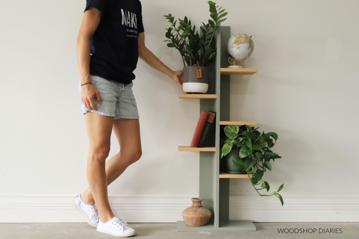 Shara Woodshop Diaries placing plant on top left of DIY plant shelf