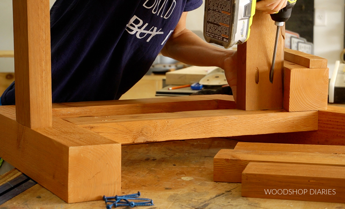 Close up driving pocket holes to secure seat slats on loveseat build