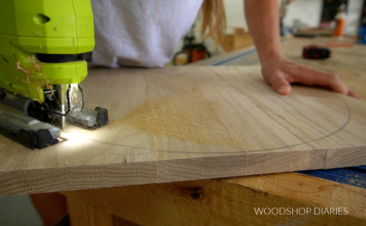 Close up of jig saw cutting circle on white oak panel