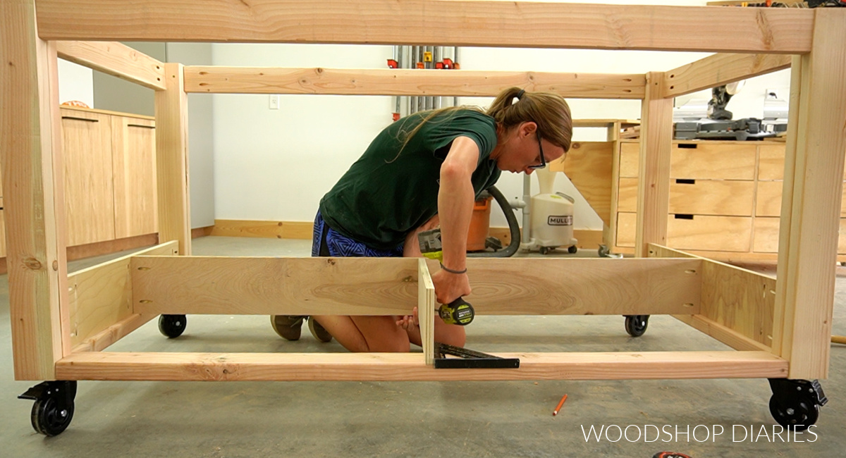Shara Woodshop Diaries installing drawer divider panels into workbench frame